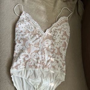 Lace white bodysuit. Never been worn!
